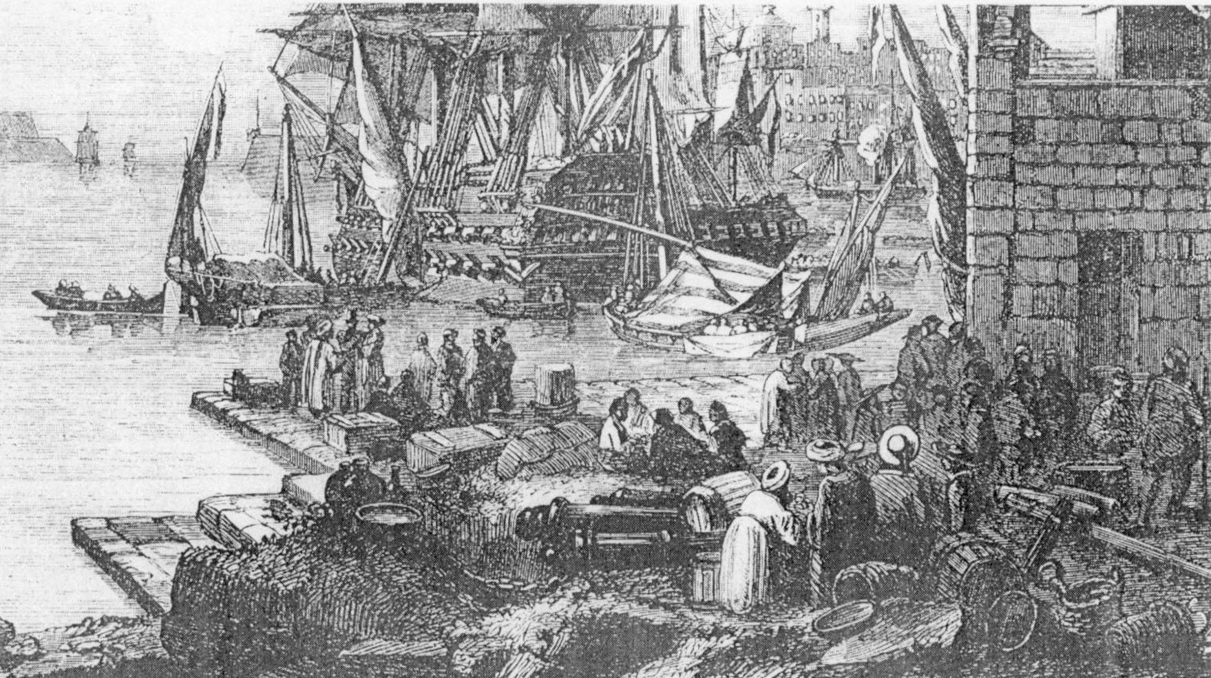Commerçants maltais à Ras Hanzir Des commerçants Maltais attendant sur le quai de Ras Hanzir, prêts à embarquer pour des ports méditerranéens